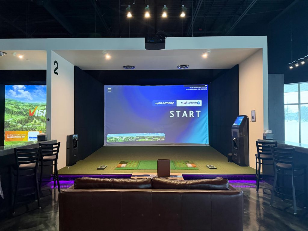 Golfzon simulator bay with lounge seating